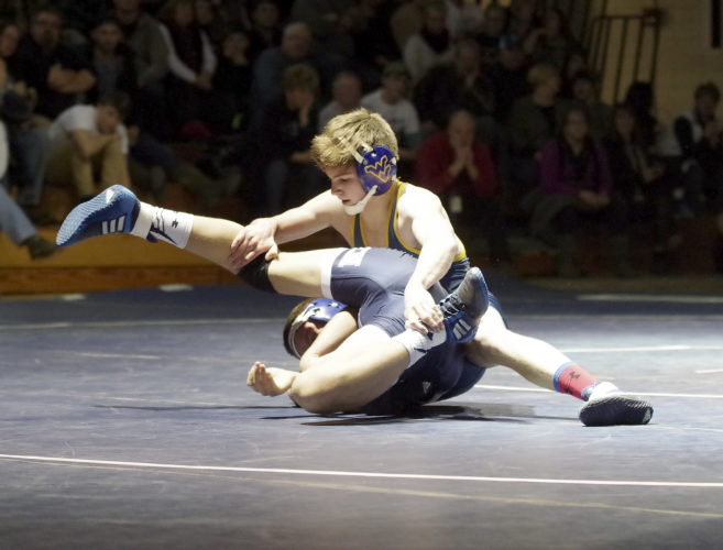 Times Observer photo by Ben Oviatt Eisenhower's Nate Holt wrestles with Warren's John Fankhouser.